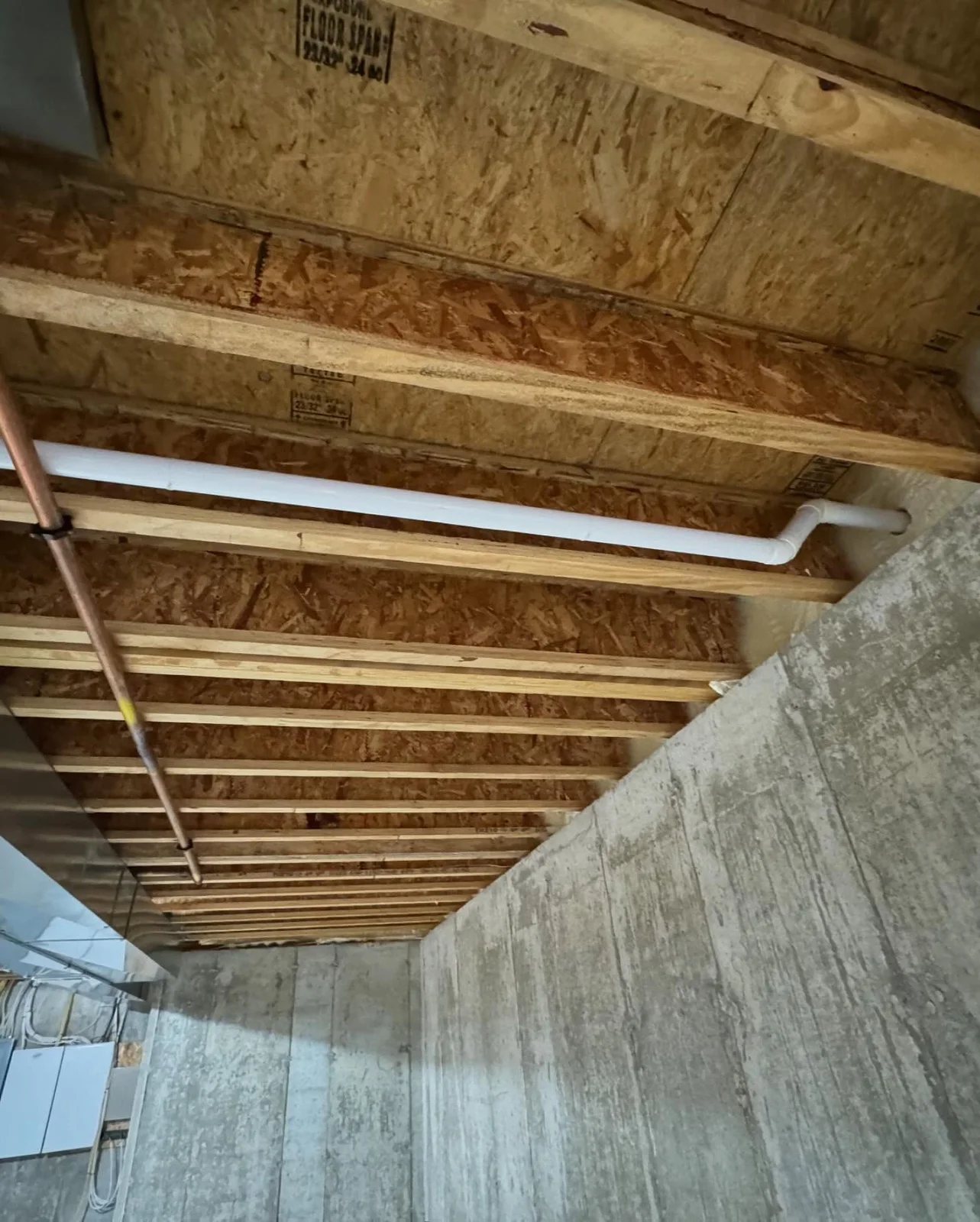 Central vacuum tubing routed through a crawlspace during installation planning
