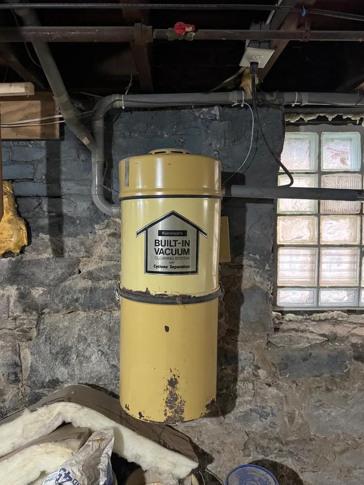 Yellow Kenmore central vacuum power unit