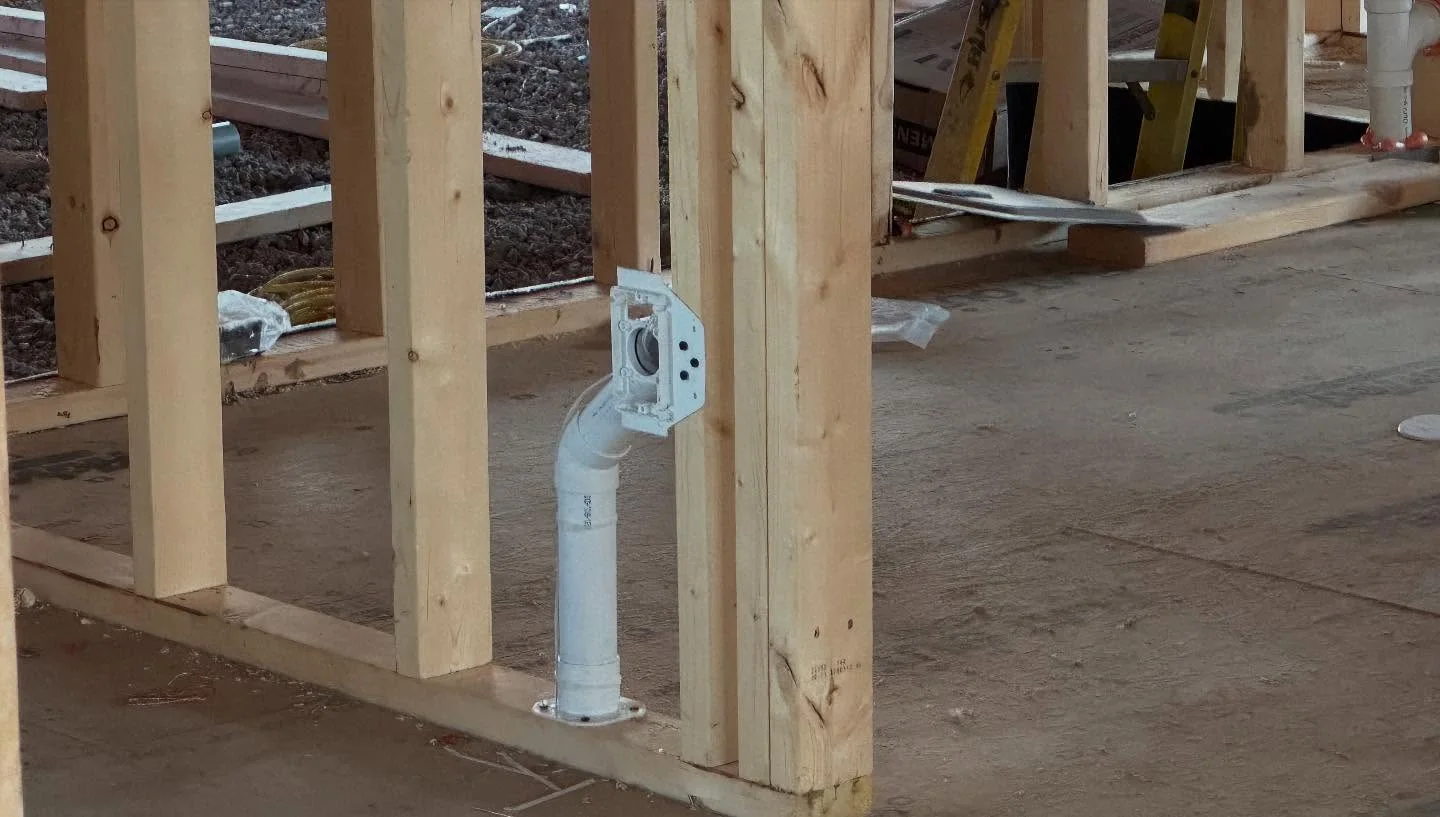Central vacuum inlet rough-in placed between wall studs