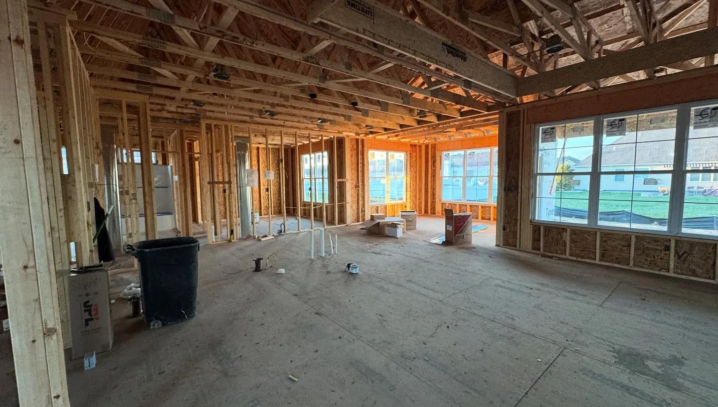Central vacuum tubing routed through open framing