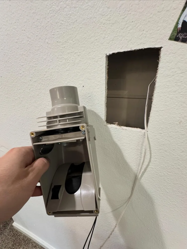 Wall opening used during an existing-home central vacuum retrofit
